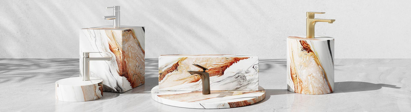 Short basin mixer taps in chrome, brushed nickel and brushed gold on marble plinths.