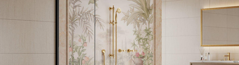 Brushed-gold exposed single rail with handheld and matching wall tap set on a botanical shower wall.
