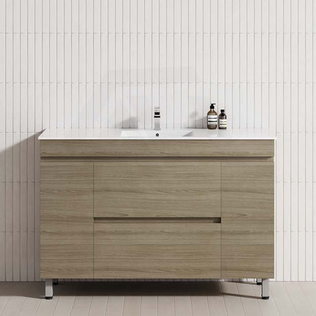 Modern bathroom vanity with a white tile wall, featuring a Maison Oak finish and a single bowl design