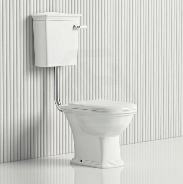 Traditional close coupled toilet with cistern and flush pipe