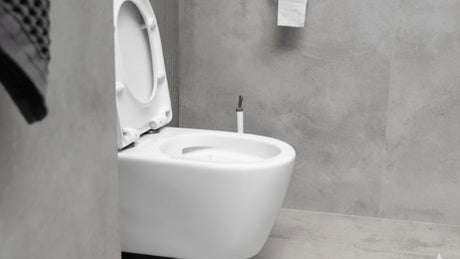 Modern wall-hung toilet in a grey bathroom