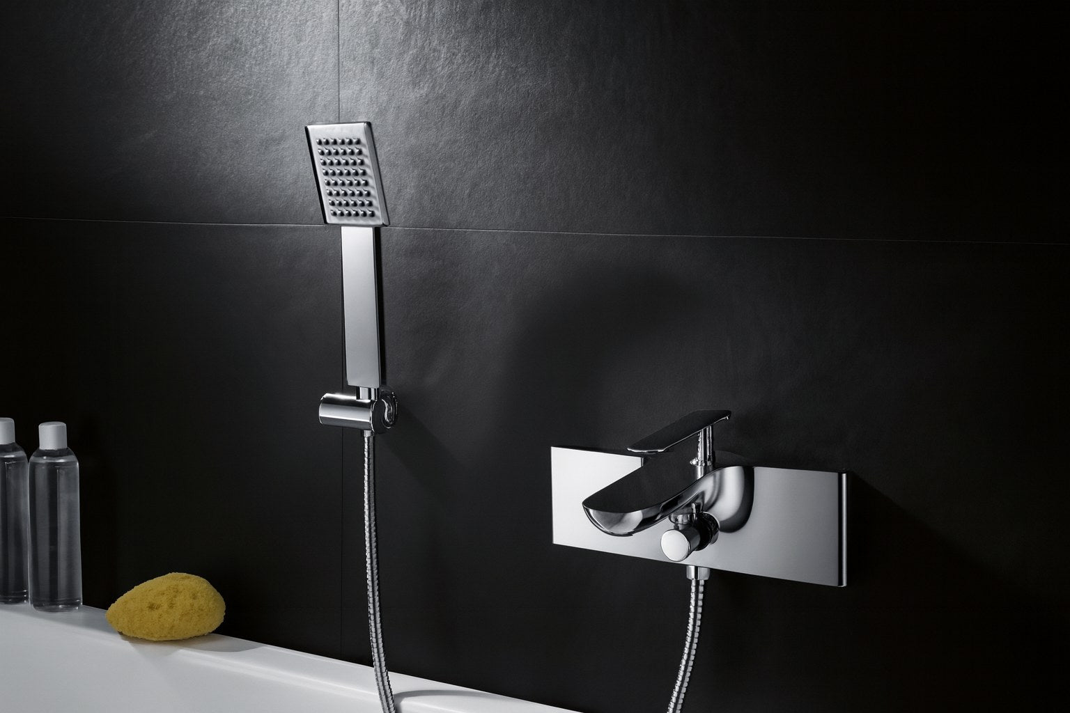 Modern chrome bath mixer tap with handheld shower