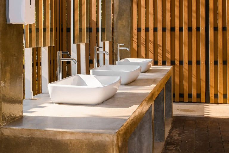 Modern bathroom with white basins and tap washers