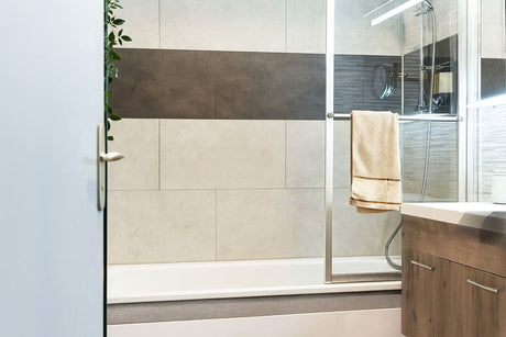 Modern bathroom with glass shower and wooden vanity