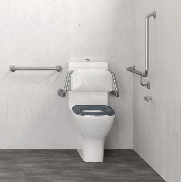 Accessible toilet with grab rails in compliant bathroom