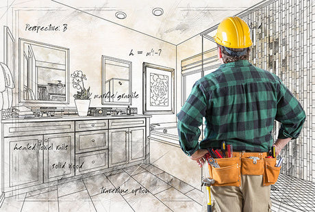 contractor reviewing bathroom renovation design sketch with vanity, shower, tile, and tool belt