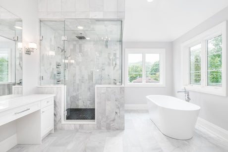 Bright modern bathroom with freestanding bathtub, ideal for bathtub resurfacing project.