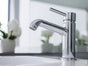 Chrome single lever tapware mixer installed on modern bathroom sink