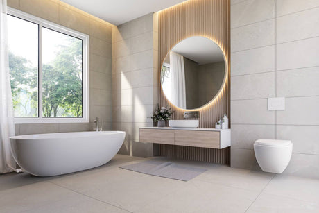 Modern bathroom with freestanding bathtub, round LED mirror, floating vanity, and large window.