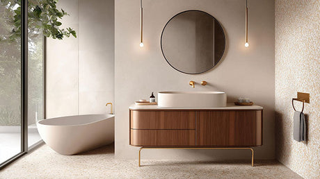 Modern bathroom with warm-toned painted walls, timber vanity, round mirror and brushed gold tapware