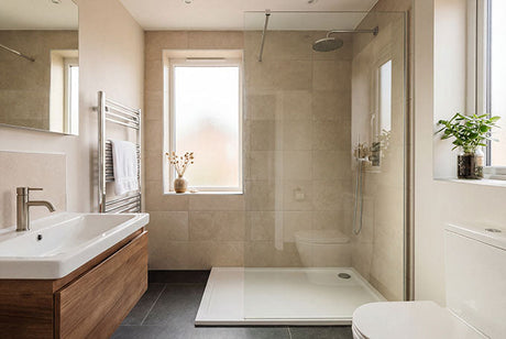 Modern small bathroom interior with walk-in shower, wooden vanity, and window