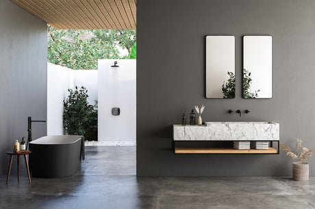Modern bathroom with black freestanding tub, marble vanity, outdoor shower, and twin mirrors