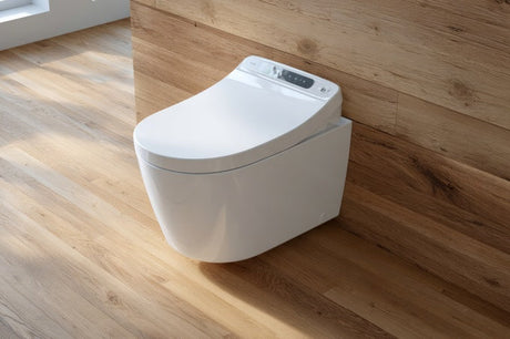 Wall-hung white smart toilet with bidet controls against timber-clad wall