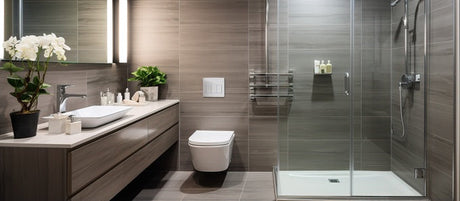 Modern bathroom with glass shower, floating vanity, wall-hung toilet, and potted orchid