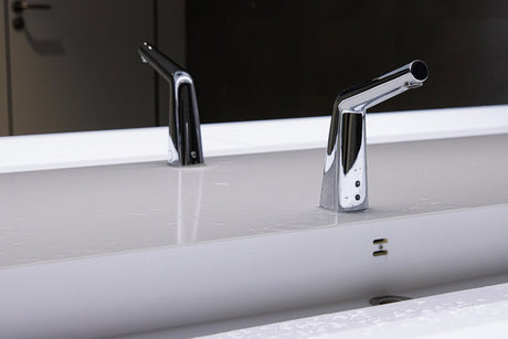 Touchless bathroom taps with sensor activation for improved hygiene.