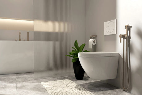 Wall-hung toilet in a modern minimalist bathroom with concealed flush plate and bidet spray.