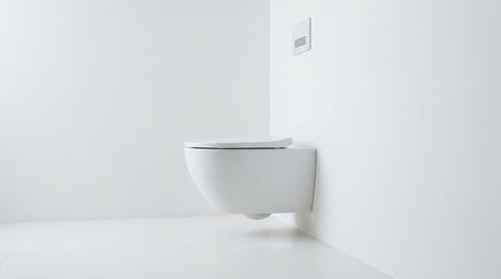 White wall-hung toilet with slim seat and concealed cistern flush plate