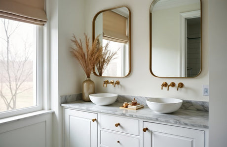 White double vanity with marble benchtop, vessel basins, gold taps and mirrors