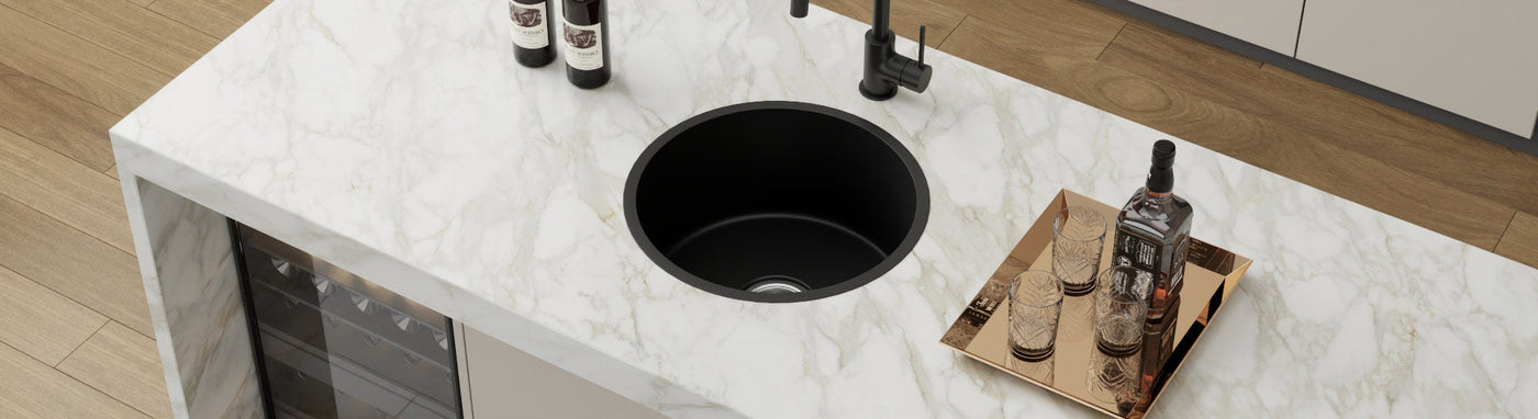 round black single bowl kitchen sink with black tap