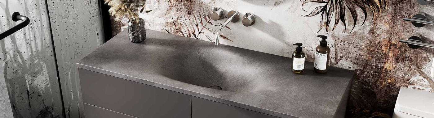 Dark grey concrete-look sintered stone vanity top with integrated basin