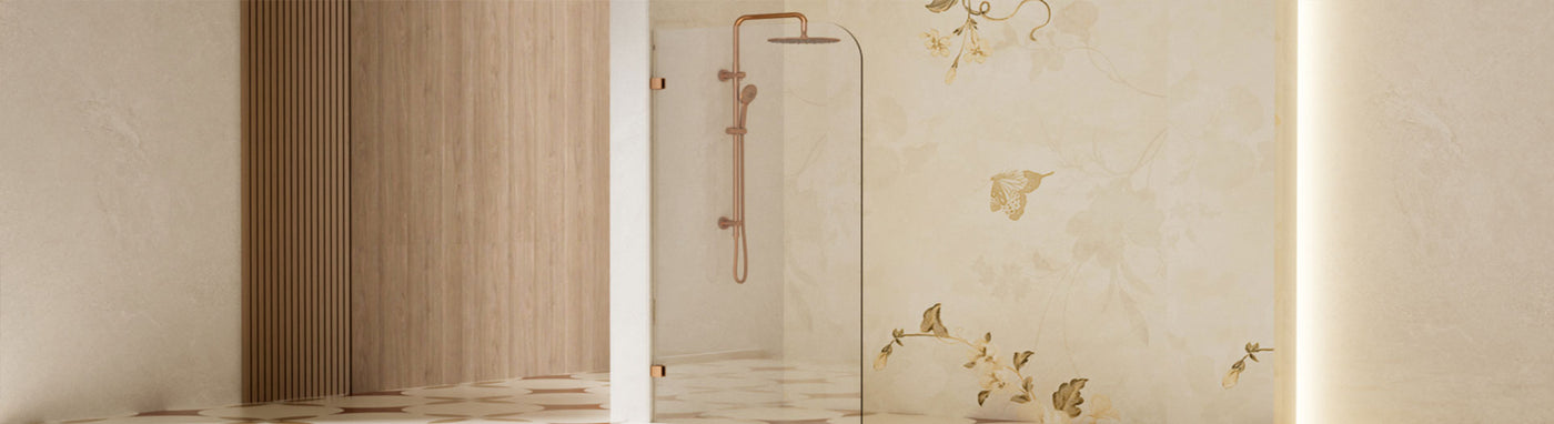 Curved glass shower screen with rounded corner and brushed gold hardware.