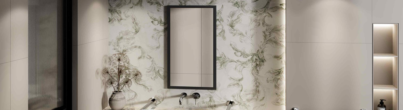 Wall-mounted mirror with a sleek black frame above a floral feature wall in a modern bathroom setting