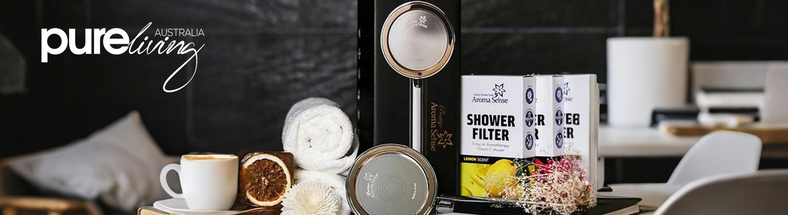 Pure Living Aroma Sense shower head and vitamin C shower filter set with towels and dried citrus décor