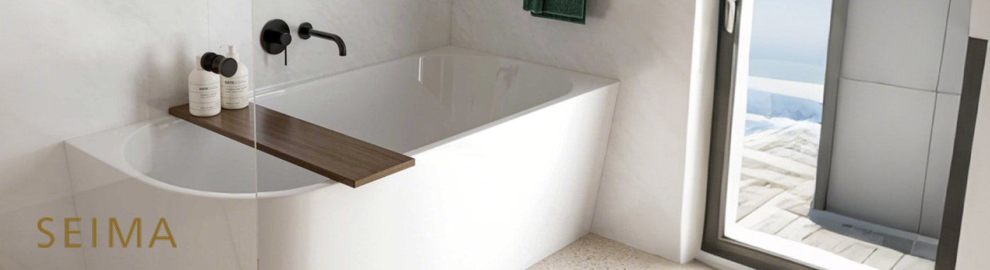 Stylish white bathtub with matte black wall-mounted tapware and timber bath tray