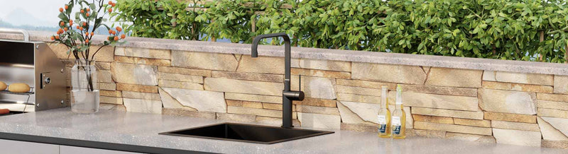 Black outdoor sink tap in BBQ area