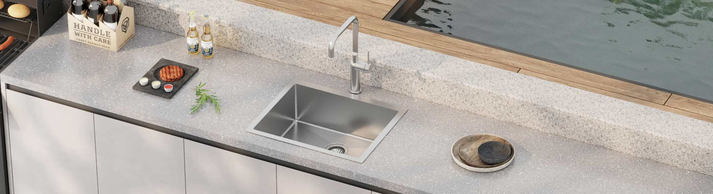 Stainless steel outdoor sink near pool