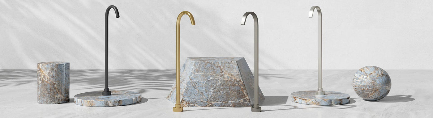 Freestanding floor bath spouts with curved gooseneck outlets in matte black, brushed brass and nickel.