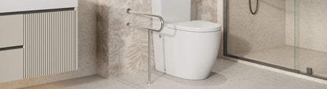 Stainless L-shaped grab rail positioned beside a modern toilet and vanity.