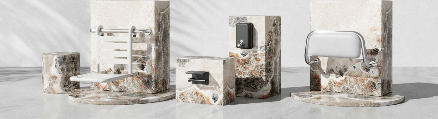 Fold-down white shower seat, wall soap dispenser and padded backrest displayed on stone plinths.