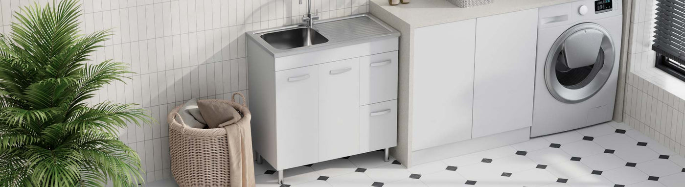 White freestanding laundry unit with stainless steel sink and drainer in a modern laundry room.
