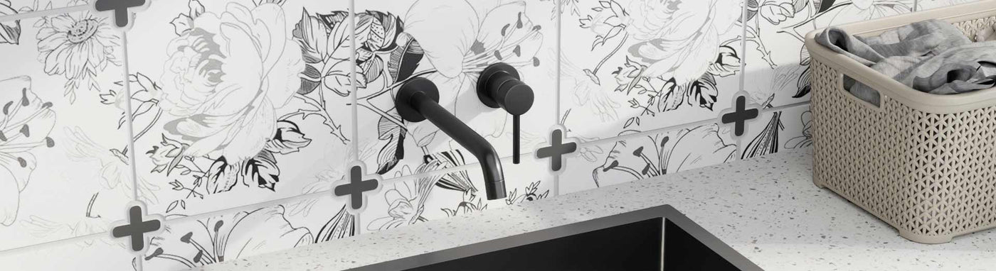 Wall-mounted laundry mixer tap sets with modern spout designs showcased on marble bases.