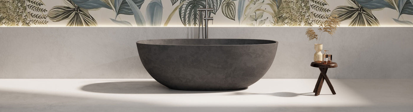 Matte black freestanding stone bath in a minimalist bathroom