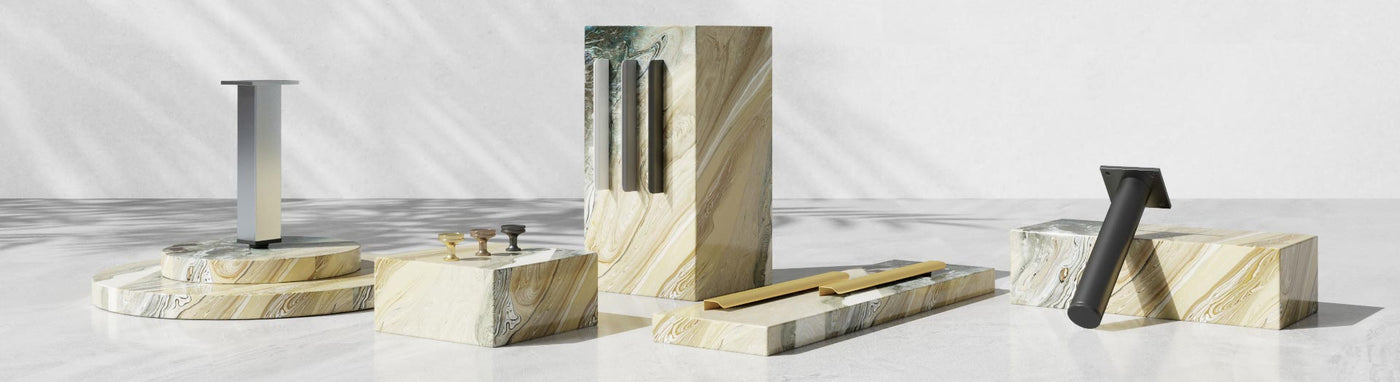 Modern vanity accessories and parts displayed on marble plinths