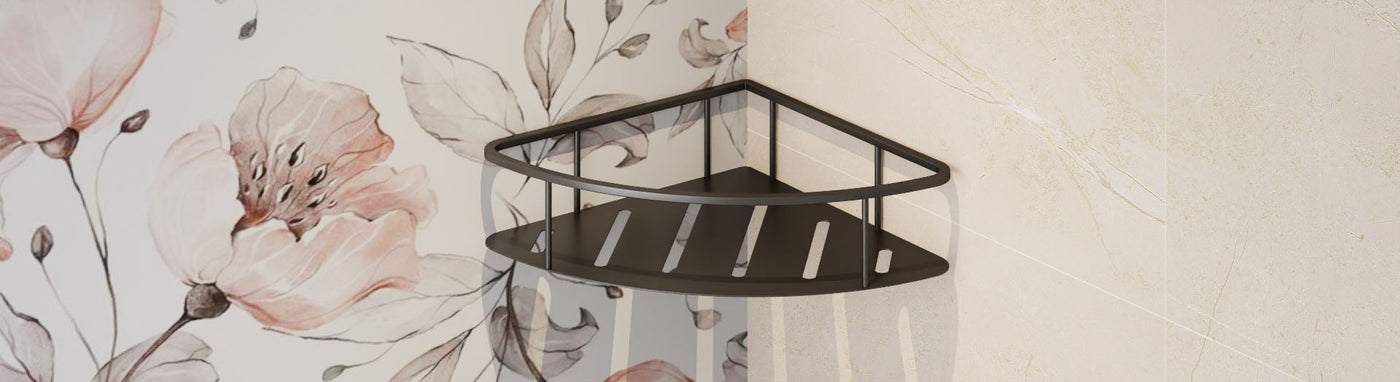 Two-tier corner shower caddy in matte black mounted between floral and stone wall tiles.