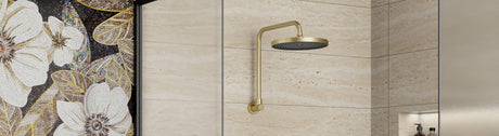 Brushed-gold round rain shower with matching wall arm on beige stone tiles