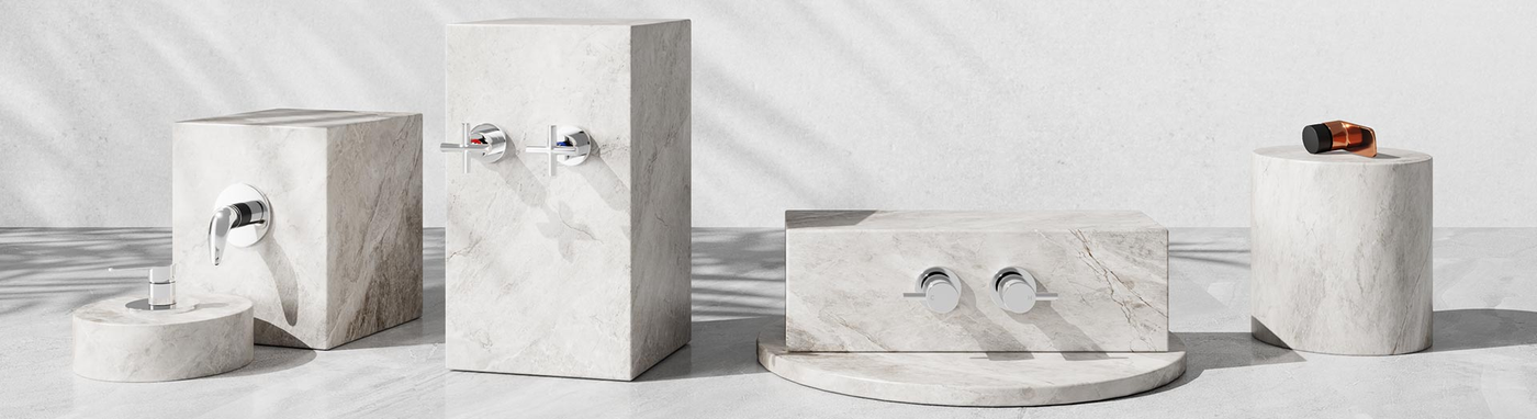 Shower tapware lineup—single-lever mixer, twin-handle sets and shut-off valve in chrome on marble plinths.