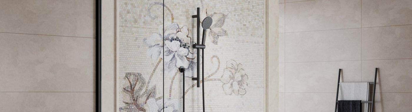 Matte-black single slide rail with round handheld set against a light mosaic floral wall.