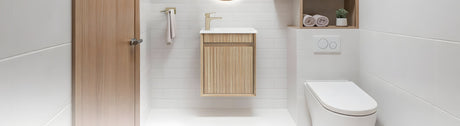 Wall hung fluted small vanity in orange finish with white basin