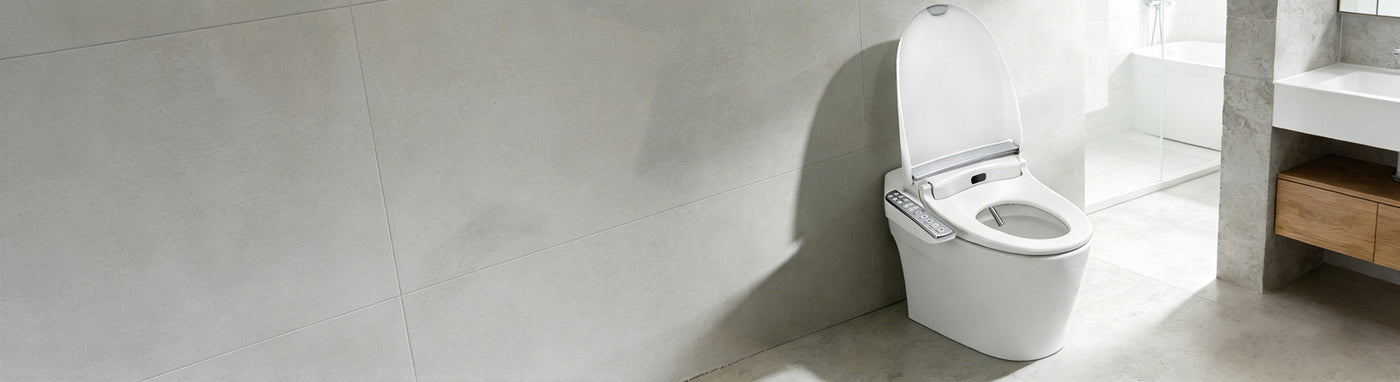 Modern bathroom with smart toilet and floral wall tiles