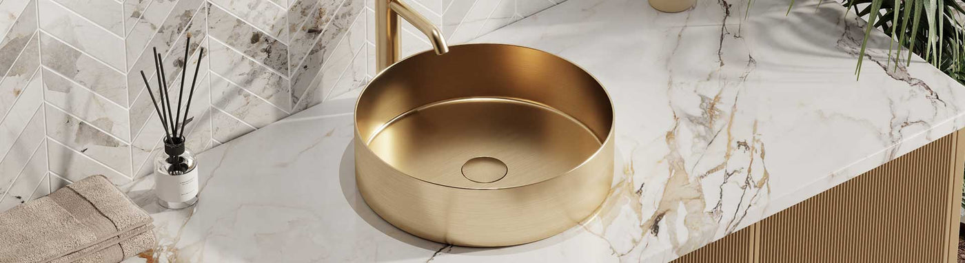 Brushed stainless steel basin with minimalist design on stone vanity top