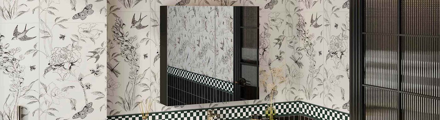 Black framed standard shaving cabinet mounted on a floral tiled bathroom wall