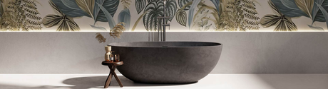 Matte black freestanding stone bath in a minimalist bathroom