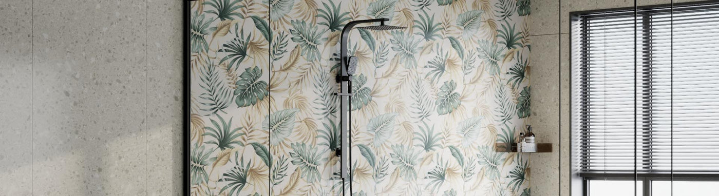 Matte-black twin rail set with a square overhead rain head and a handheld on a slider in a leafy ensuite.