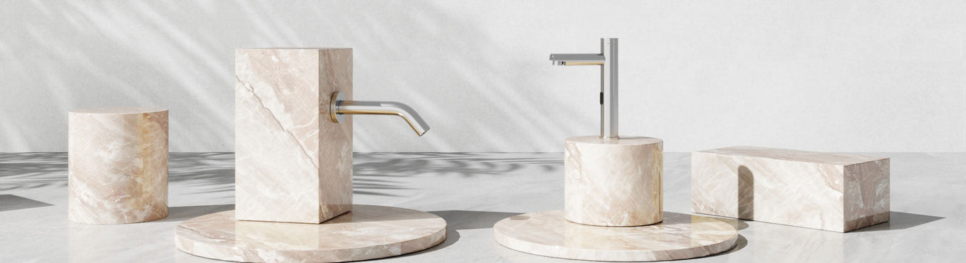 Commercial bathroom tapware with sensor mixer and wall spout.