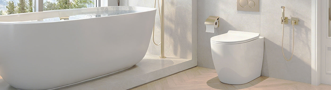 Elegant bathroom with in-wall toilet suite, freestanding bathtub, and gold fixtures