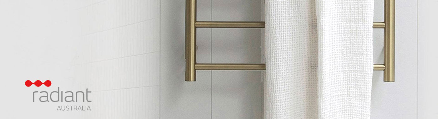 Radiant heated towel rails displayed in a modern bathroom.